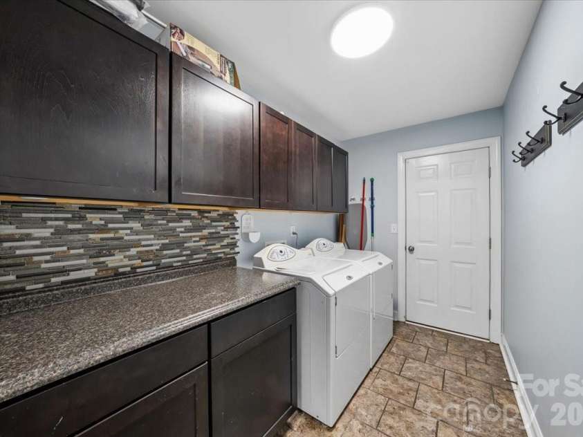1006 Spring Rose Lane, Matthews, NC 28104.  MLS# CAR4382311, YatesRealty ID 25396. Laundry Room