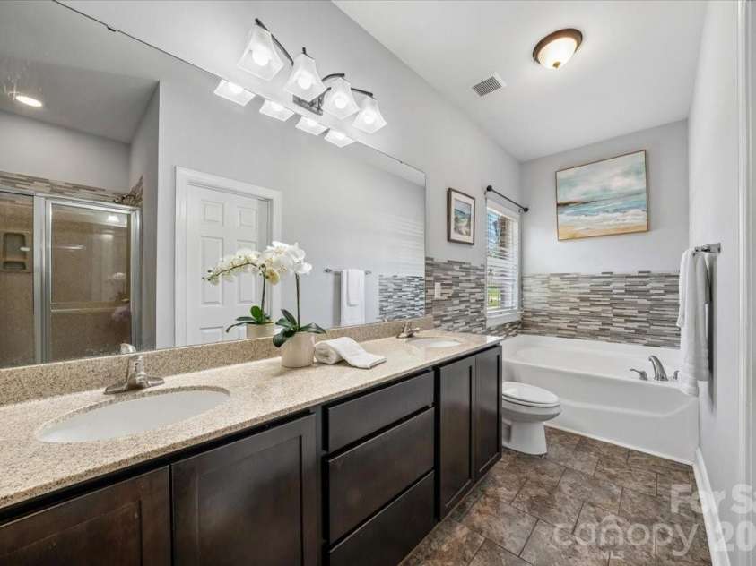 1006 Spring Rose Lane, Matthews, NC 28104.  MLS# CAR4382311, YatesRealty ID 25396. Primary Bathroom