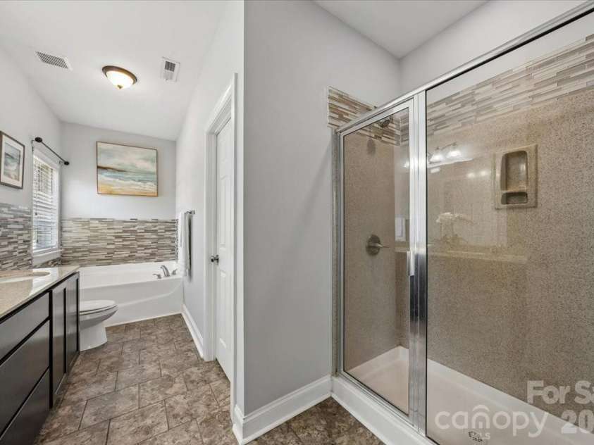 1006 Spring Rose Lane, Matthews, NC 28104.  MLS# CAR4382311, YatesRealty ID 25396. Primary Bathroom