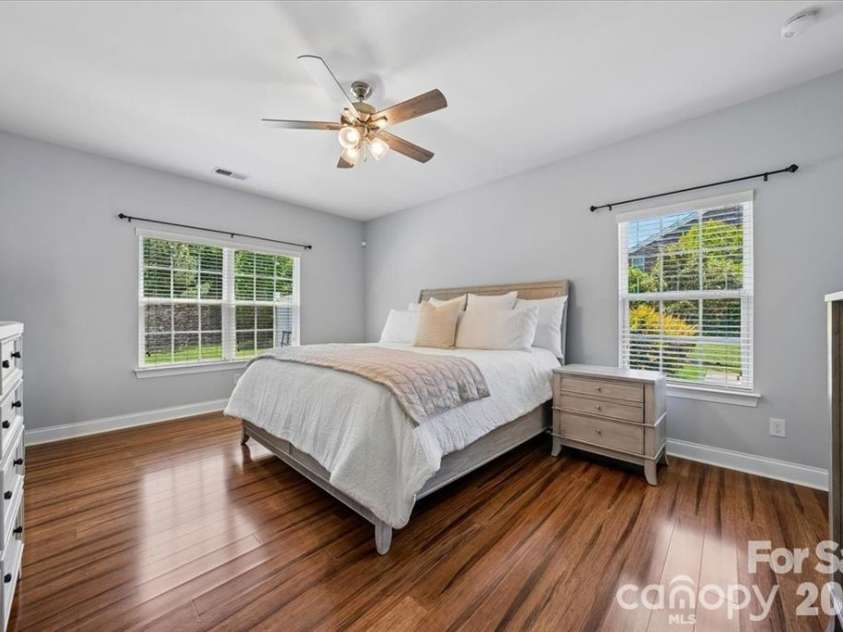 1006 Spring Rose Lane, Matthews, NC 28104.  MLS# CAR4382311, YatesRealty ID 25396. Primary Bedroom