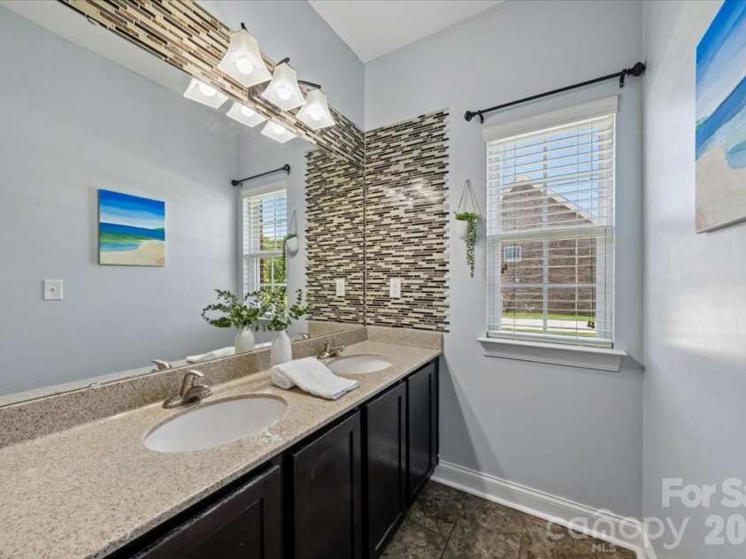 1006 Spring Rose Lane, Matthews, NC 28104.  MLS# CAR4382311, YatesRealty ID 25396. Second Bathroom