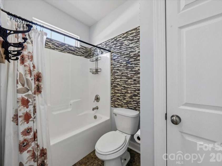 1006 Spring Rose Lane, Matthews, NC 28104.  MLS# CAR4382311, YatesRealty ID 25396. Second Bathroom