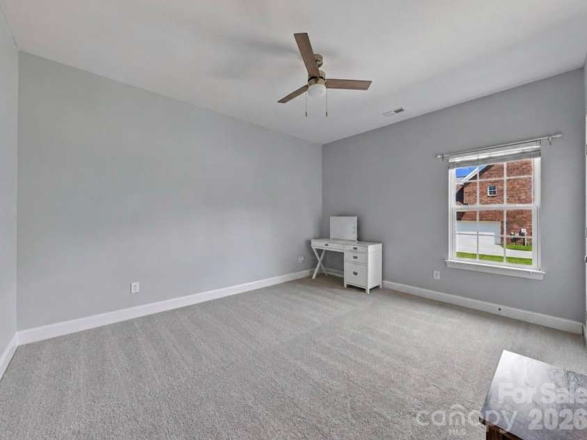 1006 Spring Rose Lane, Matthews, NC 28104.  MLS# CAR4382311, YatesRealty ID 25396. Third Bedroom *new carpet*