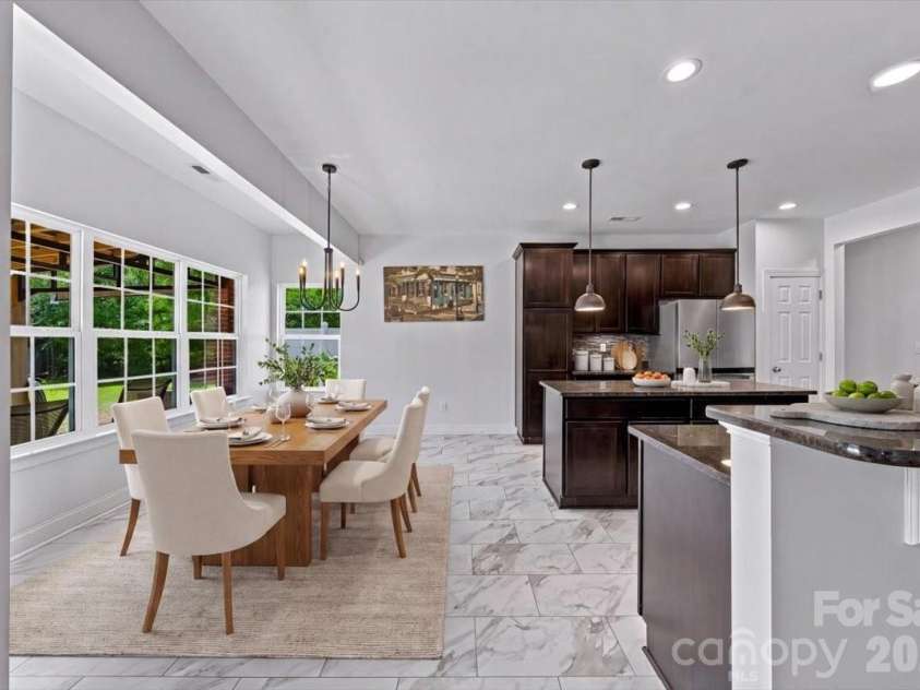 1006 Spring Rose Lane, Matthews, NC 28104.  MLS# CAR4382311, YatesRealty ID 25396. Virtually Staged Breakfast Area *new flooring*