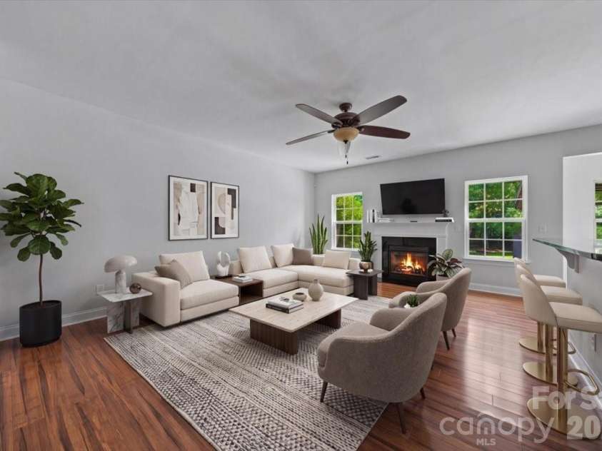 1006 Spring Rose Lane, Matthews, NC 28104.  MLS# CAR4382311, YatesRealty ID 25396. Virtually Staged Living Room