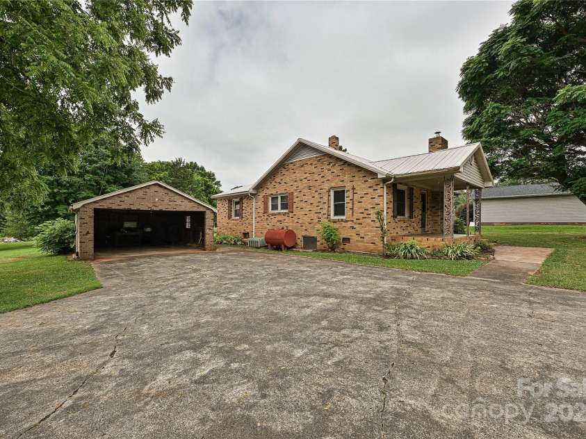 1212 Salem Church Road, Lincolnton, NC 28092.  MLS# CAR4279643, YatesRealty ID 25405. Driveway and side of home