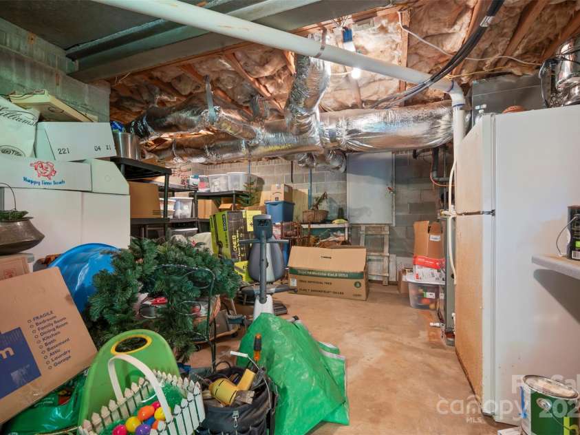 85 Red Bird Road, Tryon, NC 28782.  MLS# CAR4278468, YatesRealty ID 25406. Basement Storage