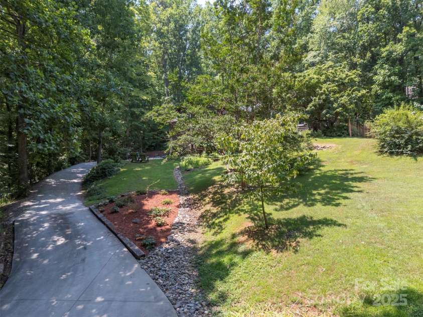 85 Red Bird Road, Tryon, NC 28782.  MLS# CAR4278468, YatesRealty ID 25406. Driveway from Road