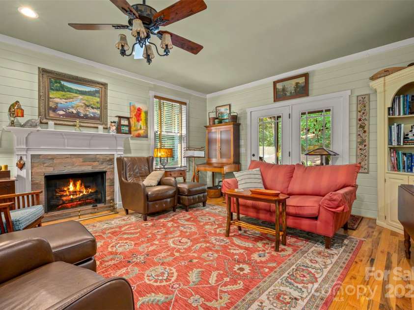 85 Red Bird Road, Tryon, NC 28782.  MLS# CAR4278468, YatesRealty ID 25406. Living Room to Screened Porch and Rear Entry