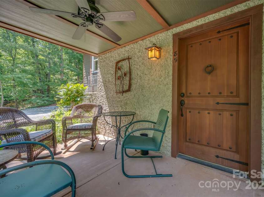 85 Red Bird Road, Tryon, NC 28782.  MLS# CAR4278468, YatesRealty ID 25406. Lower Level Covered Patio and Basement Entry