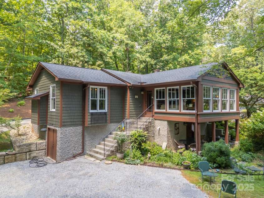 85 Red Bird Road, Tryon, NC 28782.  MLS# CAR4278468, YatesRealty ID 25406. Side Elevation and 2nd Basement Space