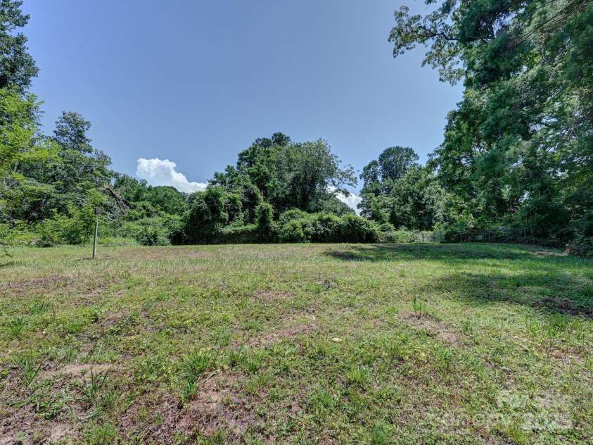 123 Blake Drive, Arden, NC 28704.  MLS# CAR4276075, YatesRealty ID 25432. Property Goes Approx to Pole-RR Easement is Beyond to Fence