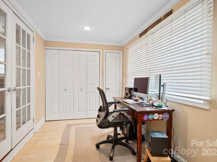 3612 Trent Street, Charlotte, NC 28209.  MLS# CAR4271192, YatesRealty ID 25435. Unheated den space with laundry and access to backyard