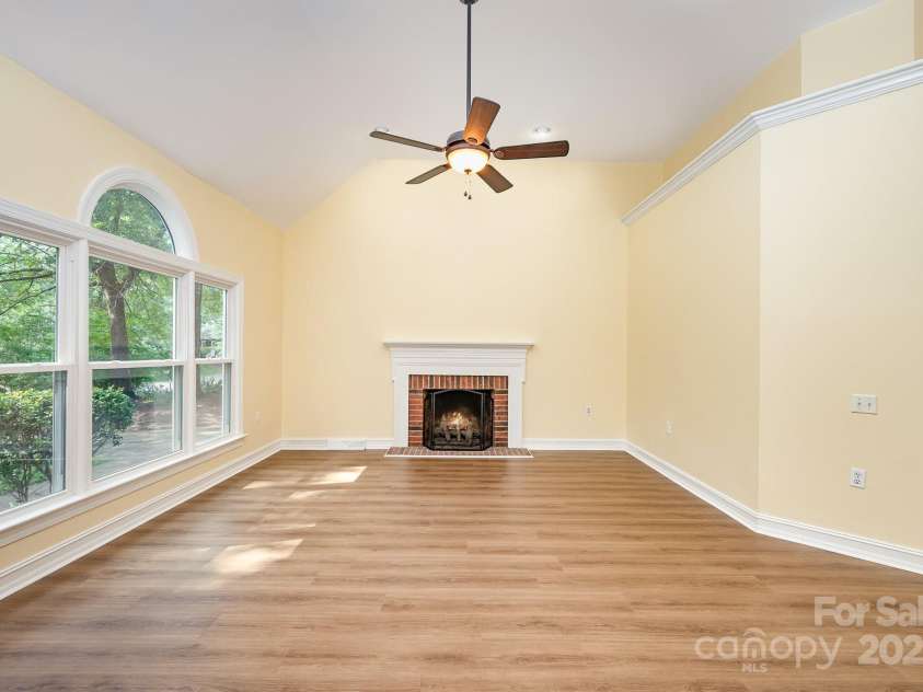 975 Pine Knoll Road, Fort Mill, SC 29715.  MLS# CAR4274032, YatesRealty ID 25440. Oversized living room with cozy fireplace