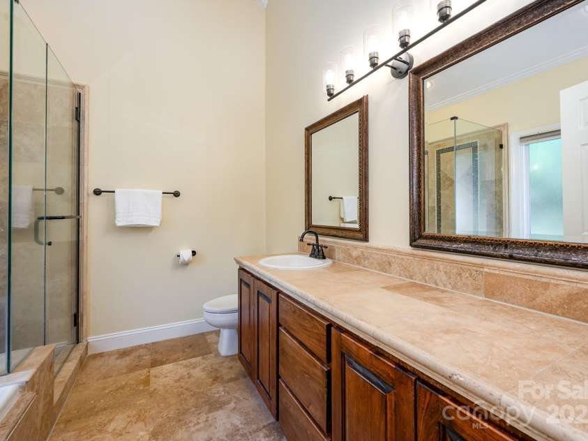 975 Pine Knoll Road, Fort Mill, SC 29715.  MLS# CAR4274032, YatesRealty ID 25440. Primary bathroom has a vaulted ceiling and plenty of space at the oversized vanity
