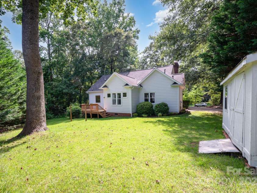 975 Pine Knoll Road, Fort Mill, SC 29715.  MLS# CAR4274032, YatesRealty ID 25440. Storage shed conveys with the property. Level and wooded back yard!