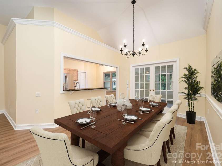 975 Pine Knoll Road, Fort Mill, SC 29715.  MLS# CAR4274032, YatesRealty ID 25440. Sunroom directly off the large dining area. Virtually staged.