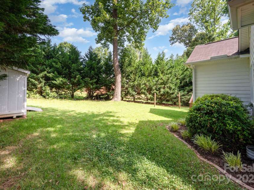 975 Pine Knoll Road, Fort Mill, SC 29715.  MLS# CAR4274032, YatesRealty ID 25440. Wooded and private back yard in the heart of Fort Mill!