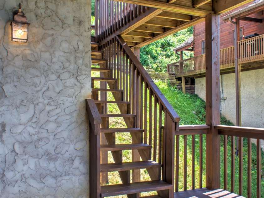 181 Scenic Wolf Drive, Mars Hill, NC 28754.  MLS# CAR4380057, YatesRealty ID 25449. Side stairs to access all decks