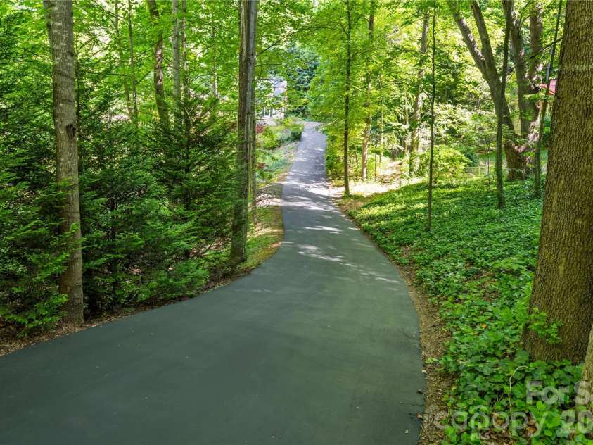 128 Churchill Downs Drive, Fairview, NC 28730.  MLS# CAR4373118, YatesRealty ID 25451. Private setting