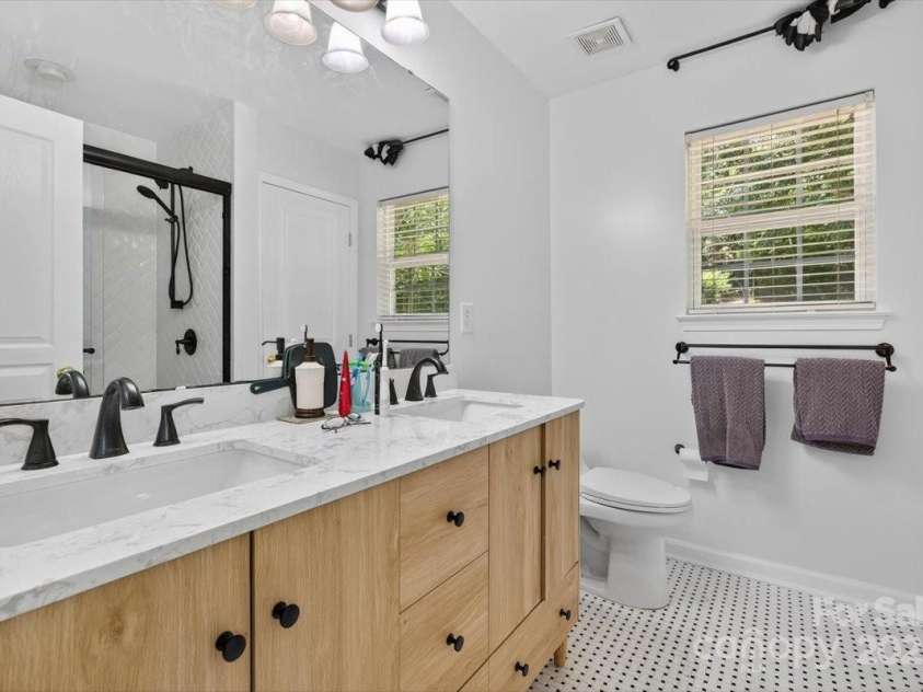73 Ashton Bluff Circle, Mount Holly, NC 28120.  MLS# CAR4280326, YatesRealty ID 25451. Newly Renovated Primary Bathroom