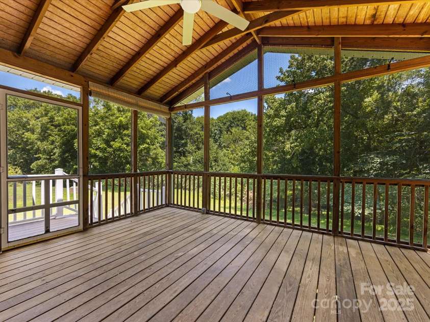 4601 Bournewood Lane, Charlotte, NC 28226.  MLS# CAR4278475, YatesRealty ID 25454. A large screened porch is a highlight of this home and extends the living space.