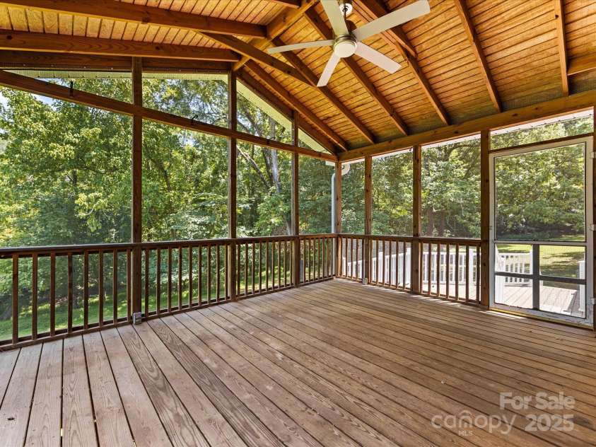 4601 Bournewood Lane, Charlotte, NC 28226.  MLS# CAR4278475, YatesRealty ID 25454. The place to be for hours overlooking the yard and trees on this over 1/2 acre lot!