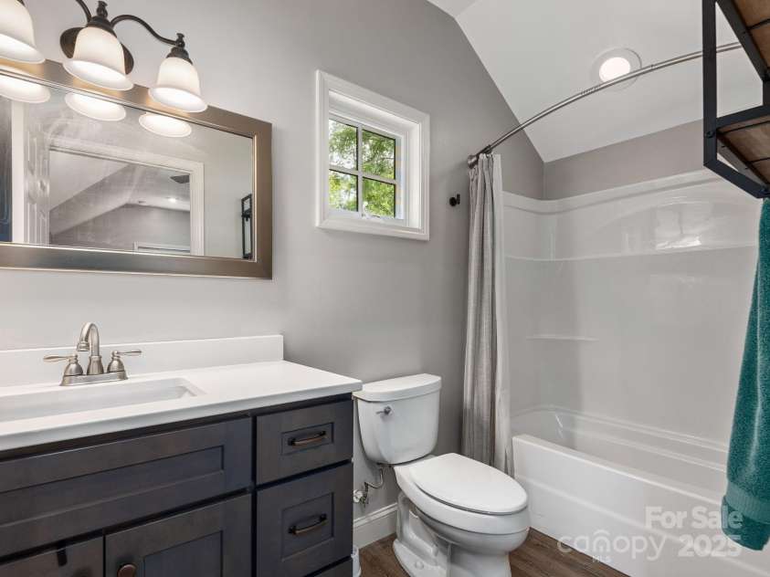 19 Albemarle Road, Asheville, NC 28801.  MLS# CAR4269476, YatesRealty ID 25459. Bathroom in the furnished studio apartment above the garage