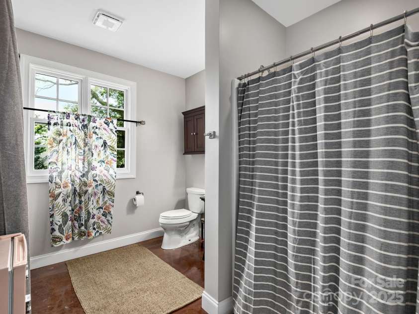 19 Albemarle Road, Asheville, NC 28801.  MLS# CAR4269476, YatesRealty ID 25459. Full bath and laundry attached to the office suite