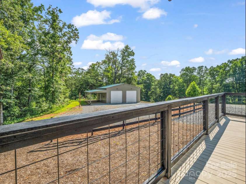 1171 Clark Road, Rutherfordton, NC 28139.  MLS# CAR4263600, YatesRealty ID 25465. Oversized garage with office built in and carport for your toys, too! Or a swing to enjoy the sunset views!