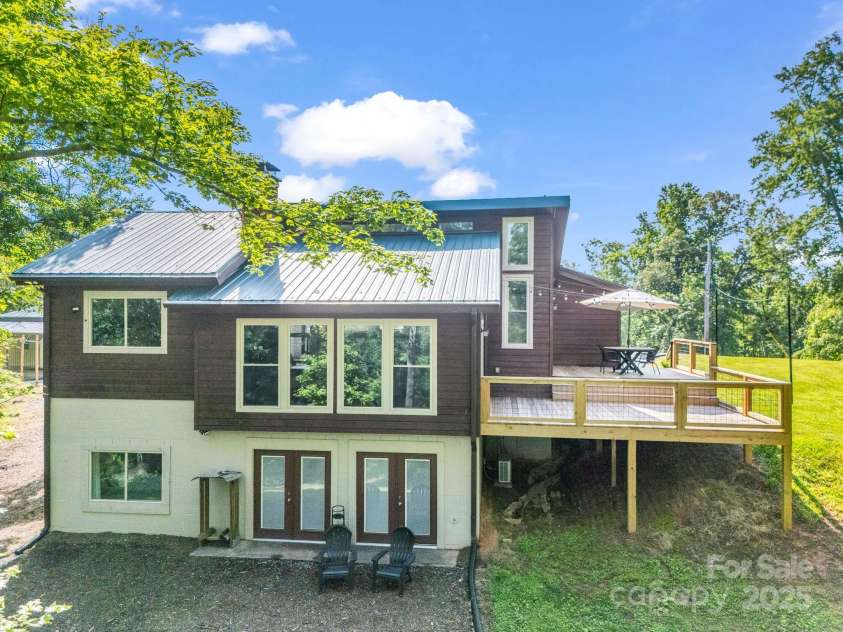 1171 Clark Road, Rutherfordton, NC 28139.  MLS# CAR4263600, YatesRealty ID 25465. The oasis you have been waiting for, with an attached and detached garage and/or additional workshop with office! ALSO, great mountain views off the back side of the home! (*Year around and opens up in the winter!)