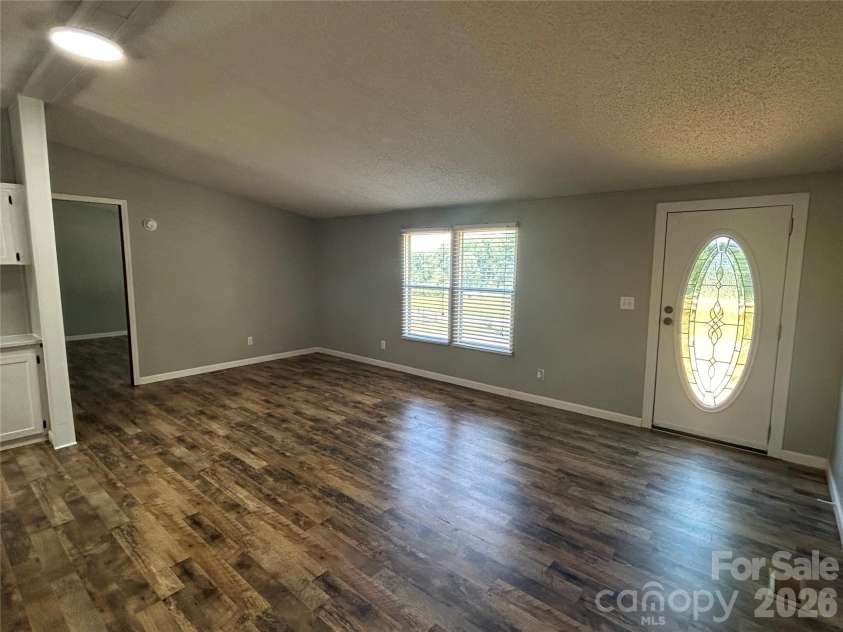 370 Walker Road, Nebo, NC 28761.  MLS# CAR4383415, YatesRealty ID 25472. Open living room area
