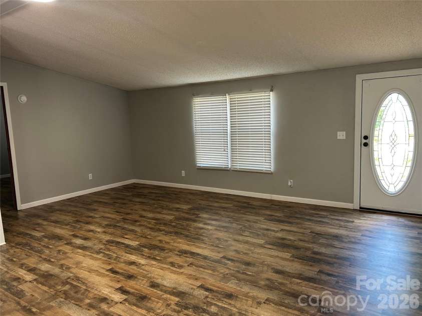 370 Walker Road, Nebo, NC 28761.  MLS# CAR4383415, YatesRealty ID 25472. Open living room area!