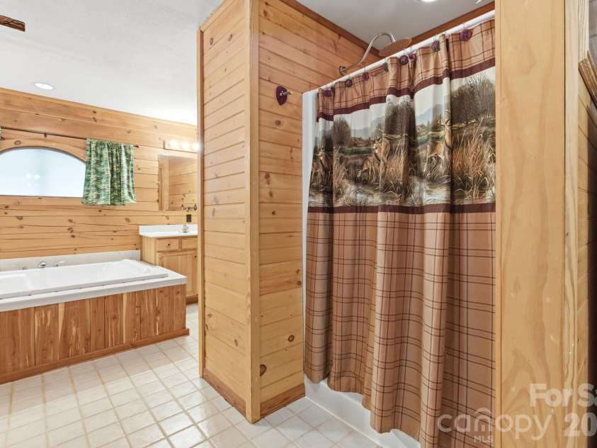 152 Rivercliff Drive, Stony Point, NC 28678.  MLS# CAR4385217, YatesRealty ID 25479. Master Walk In Shower