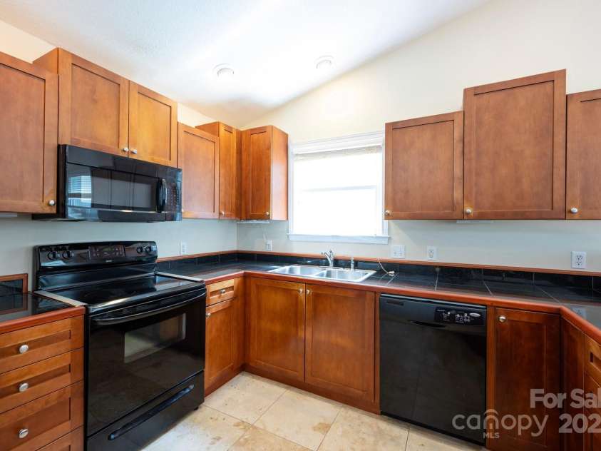 29 Honey Hollow Lane, Fairview, NC 28730.  MLS# CAR4270487, YatesRealty ID 25480. Beautiful wood cabinets