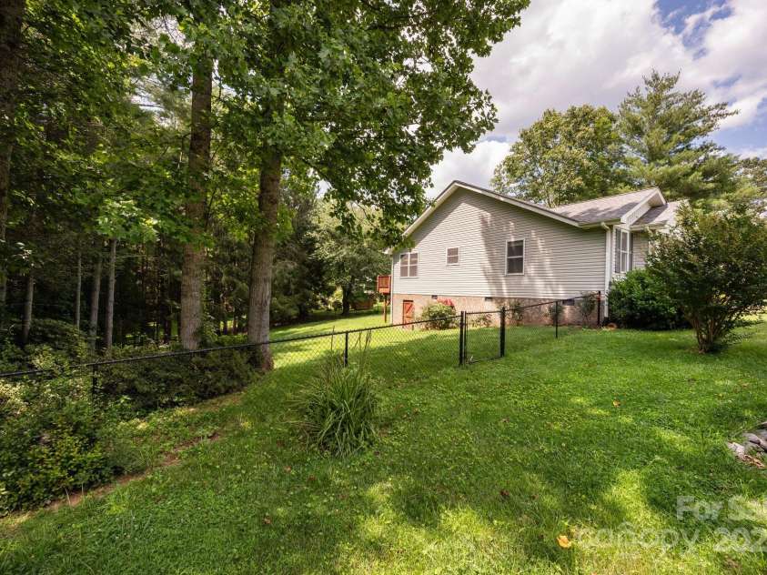 29 Honey Hollow Lane, Fairview, NC 28730.  MLS# CAR4270487, YatesRealty ID 25480. Spacious yard with fully fenced in portion