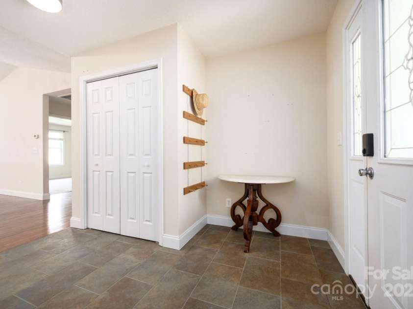 29 Honey Hollow Lane, Fairview, NC 28730.  MLS# CAR4270487, YatesRealty ID 25480. Tile entryway with closet storage