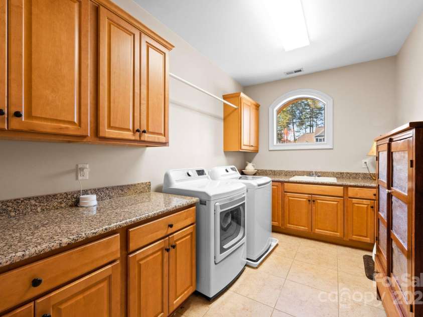 237 Wilson Lake Road, Mooresville, NC 28117.  MLS# CAR4218065, YatesRealty ID 2549. Laundry with Storage