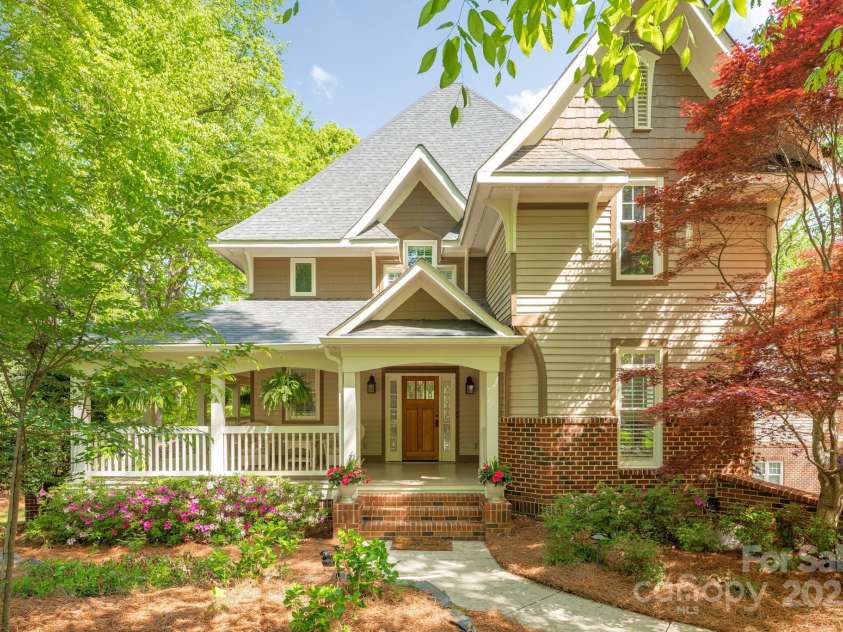 3201 Oak Brook Drive, Waxhaw, NC 28173.  MLS# CAR4247605, YatesRealty ID 25490. Charming and Welcoming Exterior with a wrap around porch - and you won't expect what's around the corner...
