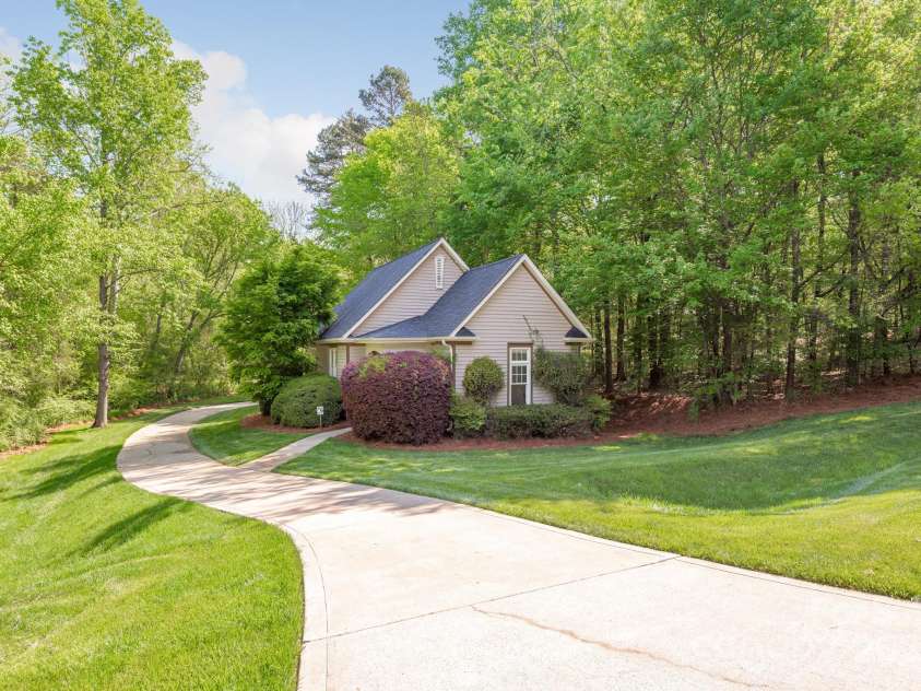 3201 Oak Brook Drive, Waxhaw, NC 28173.  MLS# CAR4247605, YatesRealty ID 25490. Secondary Garage Workshop tucked away from the Main Home but built with the same exterior detail.  Garage doors around the back of the building.