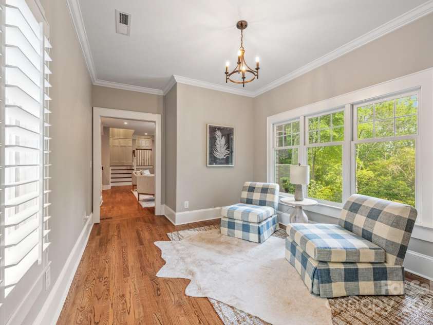 3201 Oak Brook Drive, Waxhaw, NC 28173.  MLS# CAR4247605, YatesRealty ID 25490. Sitting Area between the Den and Large Family Room.  Overlooks the gorgeous, private back yard