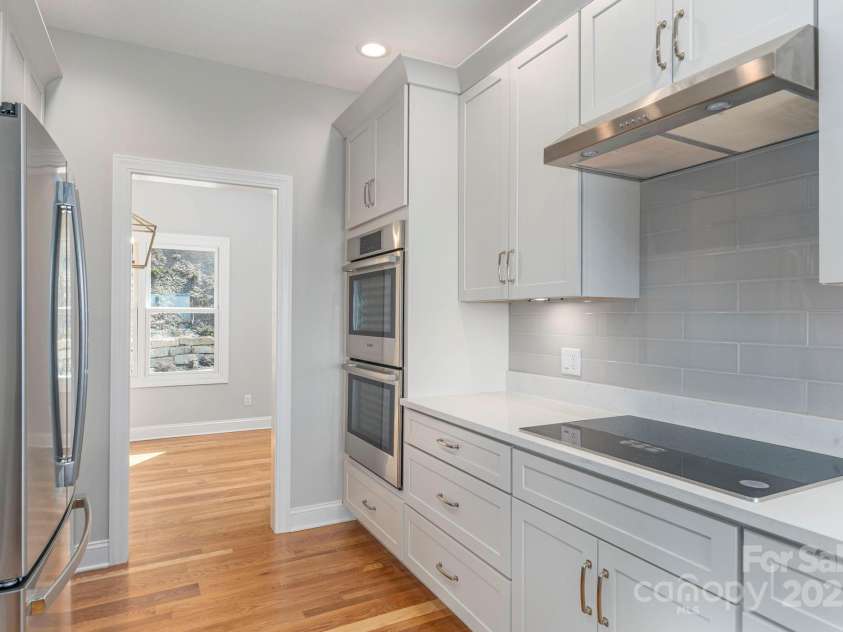 54 Herron View Lane, Weaverville, NC 28787.  MLS# CAR4225243, YatesRealty ID 25495. Double oven  and induction cooktop