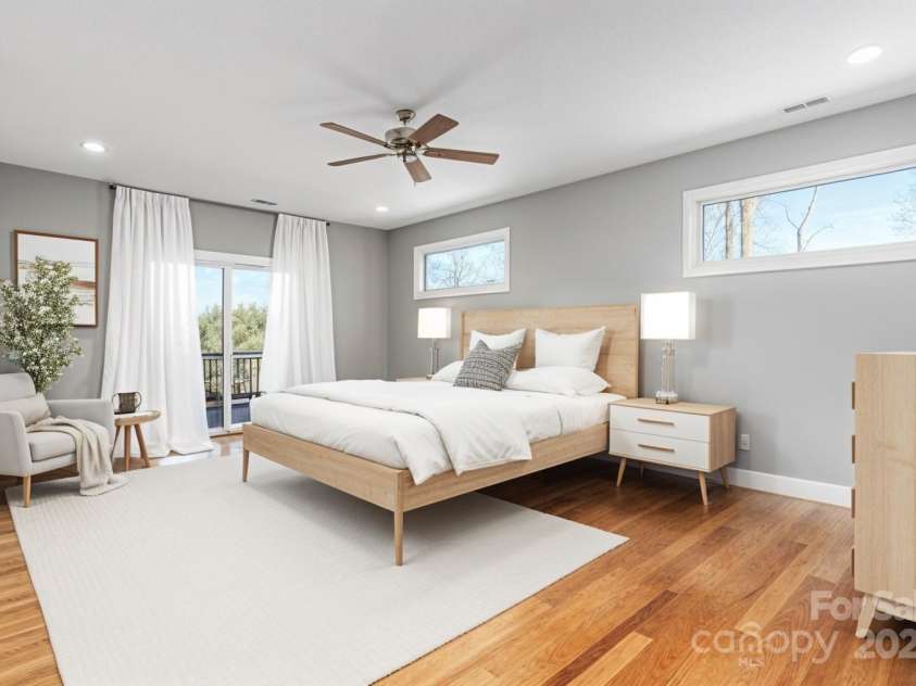 54 Herron View Lane, Weaverville, NC 28787.  MLS# CAR4225243, YatesRealty ID 25495. Spacious primary suite with deck access (Virtually staged)