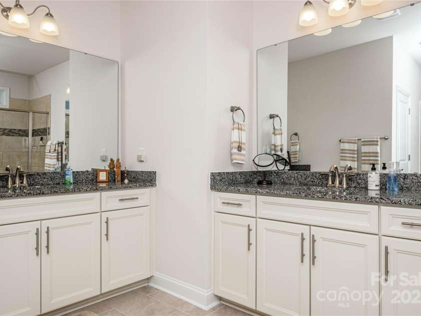 70 Cameo Drive, Flat Rock, NC 28731.  MLS# CAR4254378, YatesRealty ID 25496. Large Primary Bathroom with separate Vanities