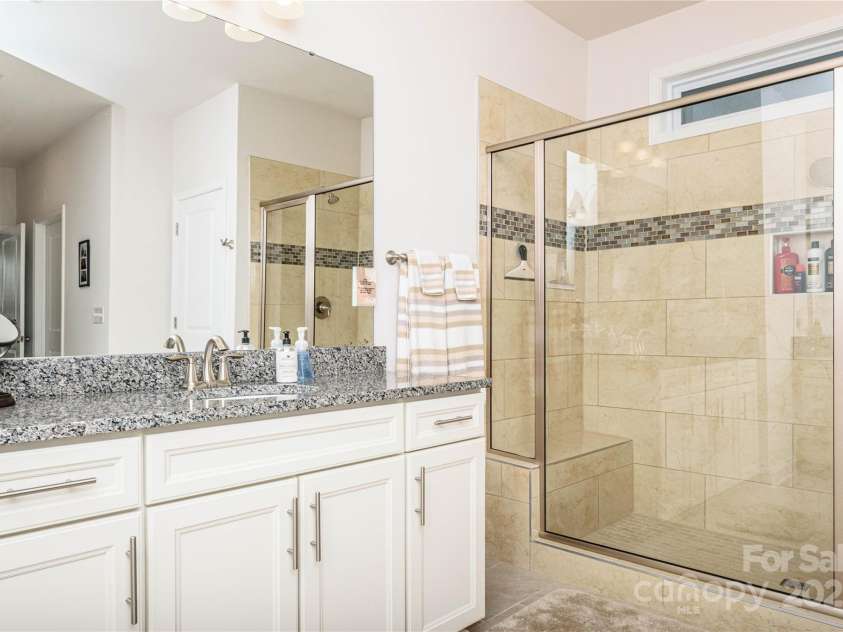 70 Cameo Drive, Flat Rock, NC 28731.  MLS# CAR4254378, YatesRealty ID 25496. Spacious walk-in shower.