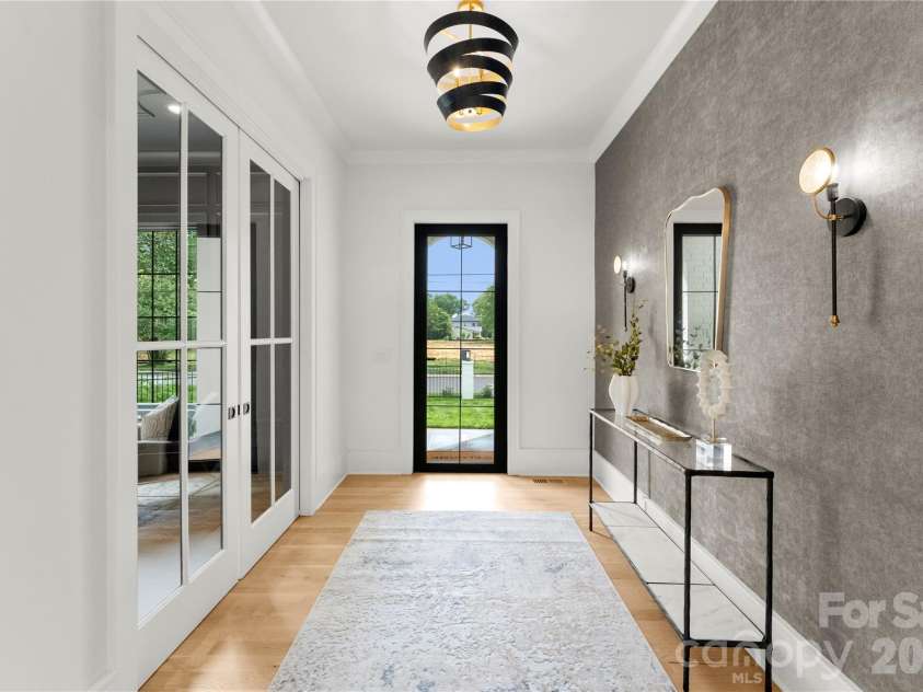 4142 Pineview Road, Charlotte, NC 28211.  MLS# CAR4384972, YatesRealty ID 25498. Iron door entry