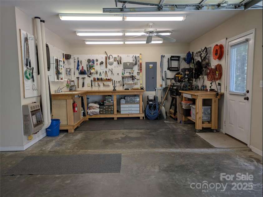 17 Sweetwater Oaks Drive, Fletcher, NC 28732.  MLS# CAR4233584, YatesRealty ID 2550. Garage workshop area
