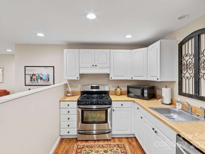17 Sweetwater Oaks Drive, Fletcher, NC 28732.  MLS# CAR4233584, YatesRealty ID 2550. Kitchen in Basement