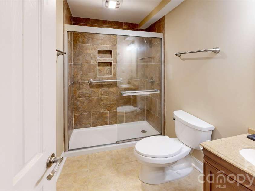 103 Woodfield Drive, Asheville, NC 28803.  MLS# CAR4386068, YatesRealty ID 25513. Lower area full bath