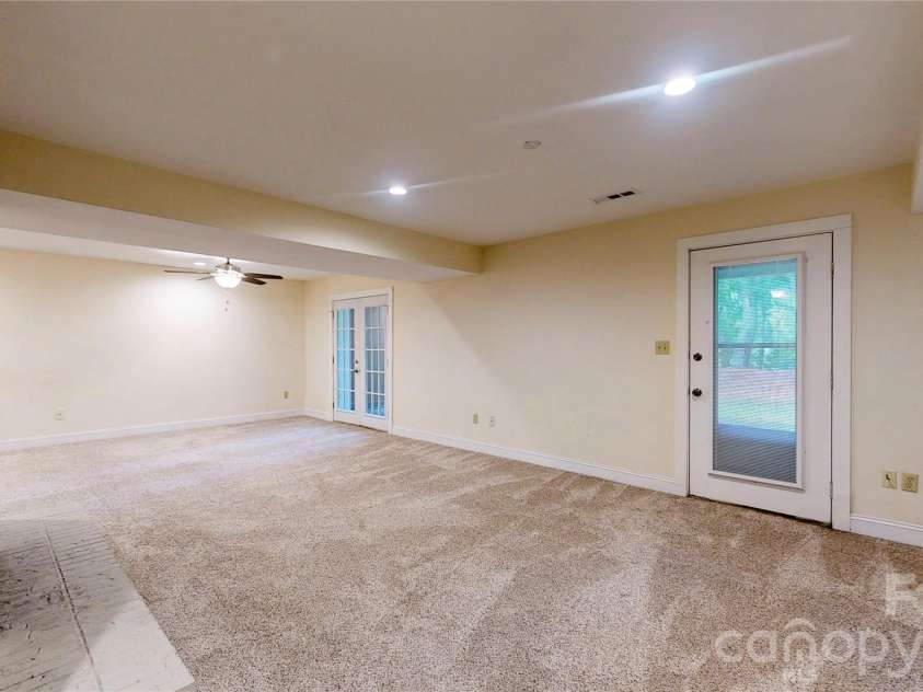 103 Woodfield Drive, Asheville, NC 28803.  MLS# CAR4386068, YatesRealty ID 25513. Lower recreation area